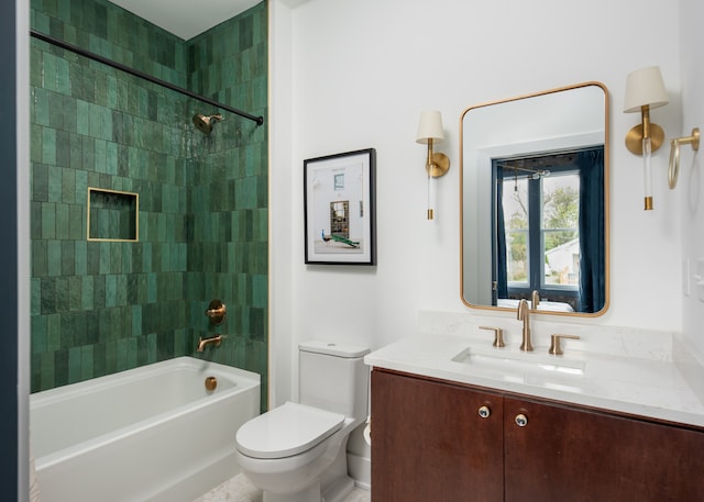 full bathroom featuring vanity, toilet, and tiled shower / bath