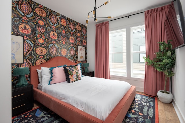 bedroom featuring multiple windows and wood-type flooring