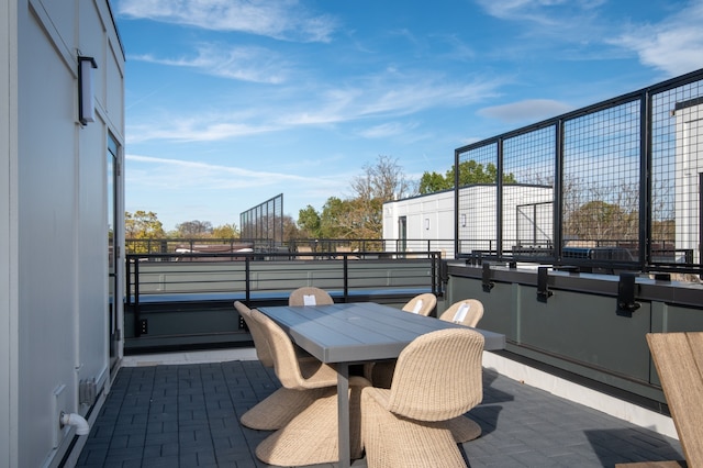 view of patio featuring a balcony