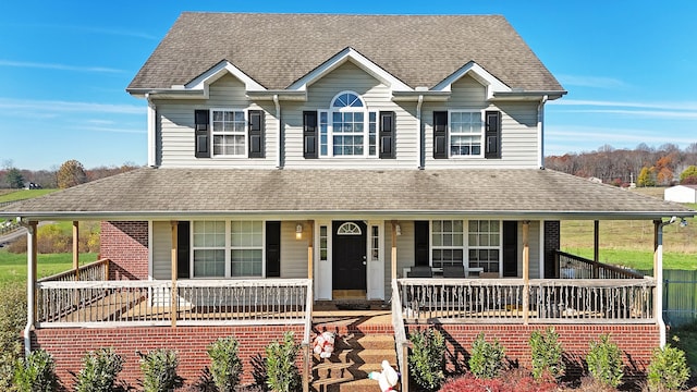 farmhouse-style home featuring a porch