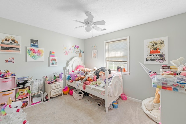 bedroom with carpet flooring, a textured ceiling, and ceiling fan