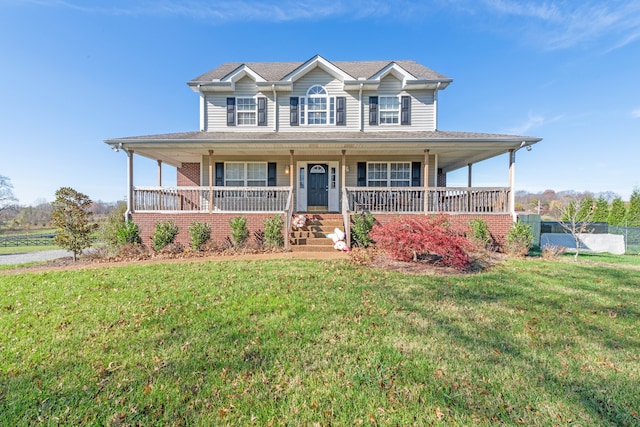 farmhouse with covered porch and a front lawn