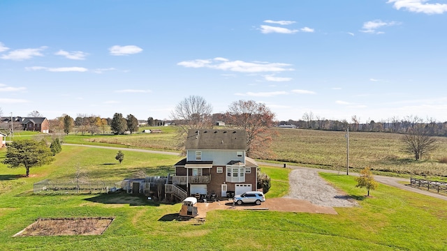 birds eye view of property with a rural view