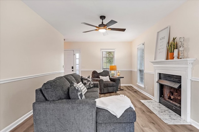 living room featuring hardwood / wood-style flooring and ceiling fan