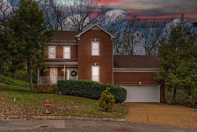 view of front facade featuring a porch and a lawn