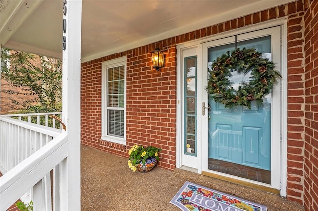 doorway to property with covered porch