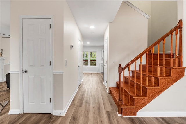 hall with light hardwood / wood-style flooring