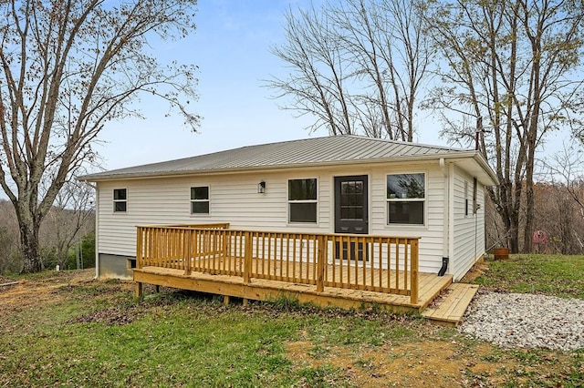 back of property featuring a deck