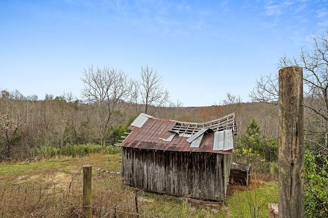 view of outbuilding with a rural view