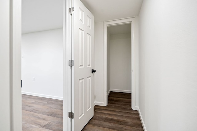 hall with dark wood-type flooring