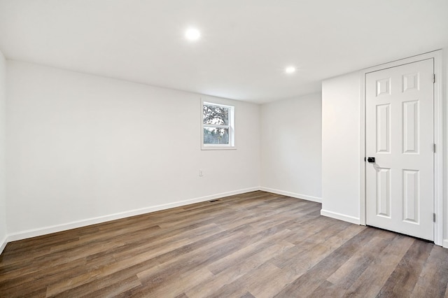 empty room featuring hardwood / wood-style flooring