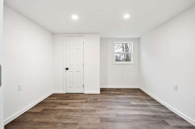 unfurnished room featuring dark hardwood / wood-style floors