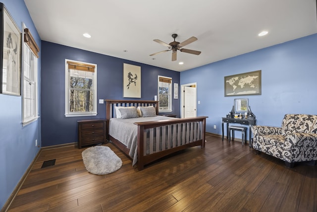 bedroom featuring ceiling fan and dark wood-type flooring