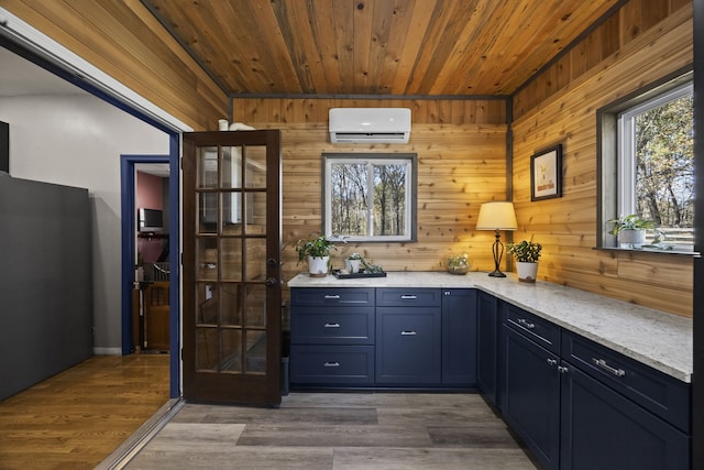 bar featuring dark wood-type flooring, a wall mounted air conditioner, light stone counters, wood walls, and wood ceiling