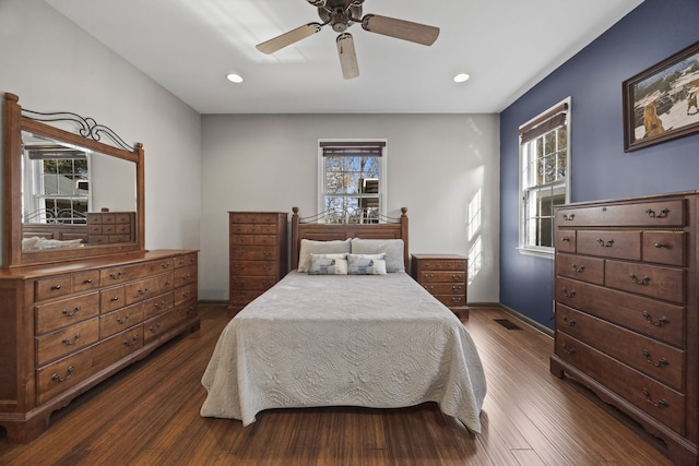 bedroom with ceiling fan and dark wood-type flooring