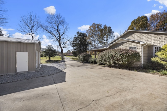 view of side of home with an outdoor structure