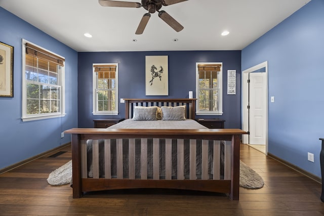 bedroom featuring ceiling fan and dark wood-type flooring