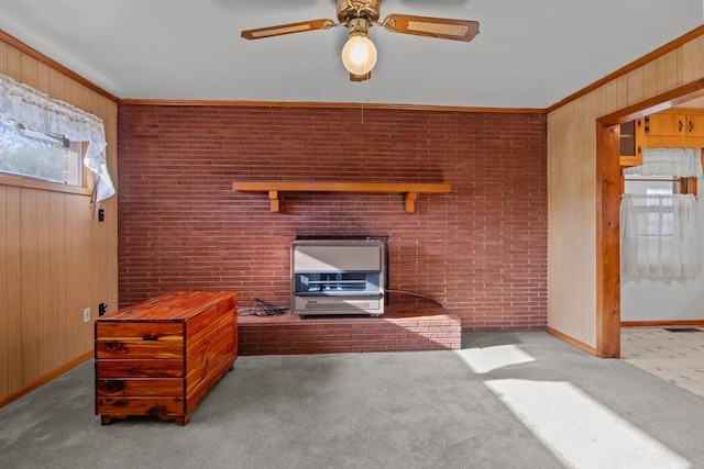 unfurnished living room with wood walls, brick wall, and ornamental molding