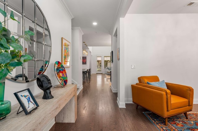 hallway featuring hardwood / wood-style floors, french doors, and ornamental molding