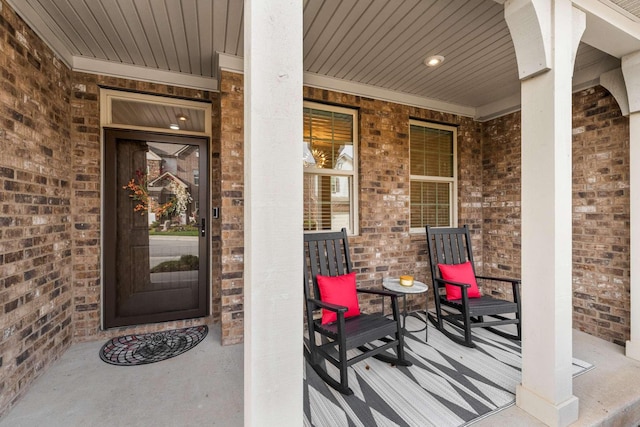 entrance to property featuring a porch