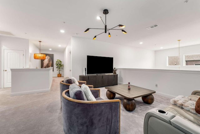 carpeted living room with a chandelier