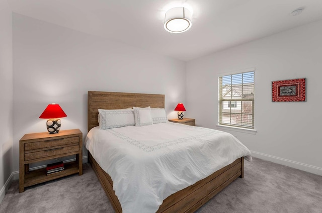 bedroom featuring light carpet