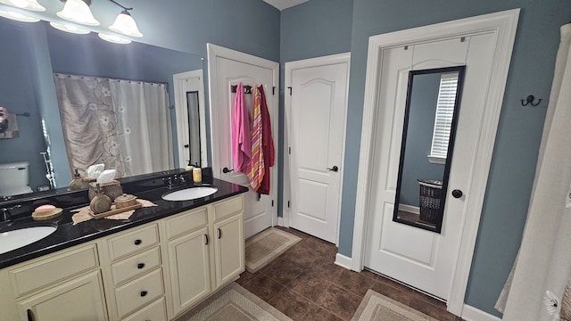 bathroom featuring tile patterned flooring and vanity