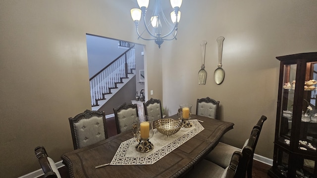 dining room featuring an inviting chandelier and hardwood / wood-style flooring