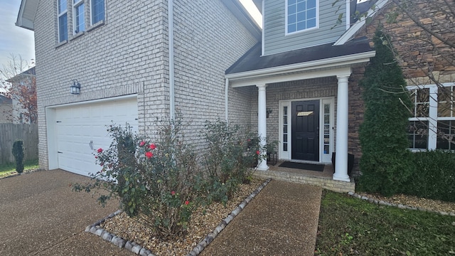 view of exterior entry with a garage