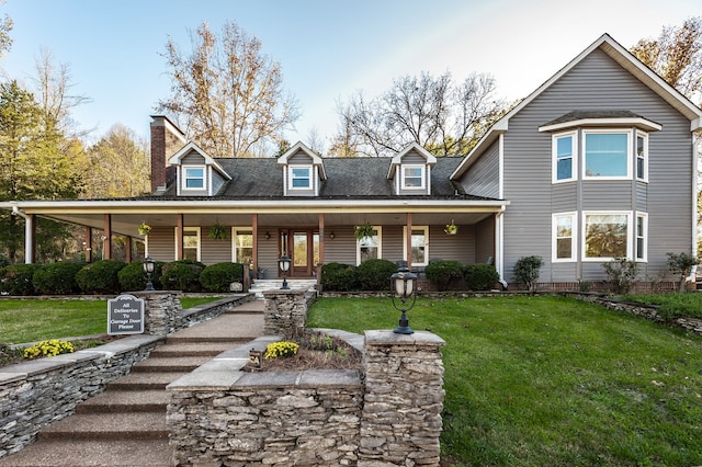 view of front of property featuring a porch and a front yard