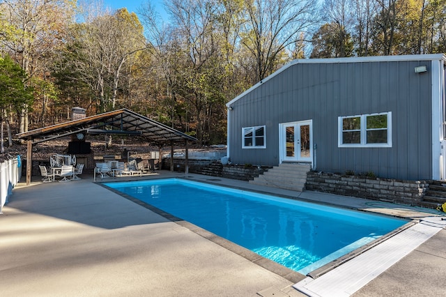 view of pool with a patio area and french doors