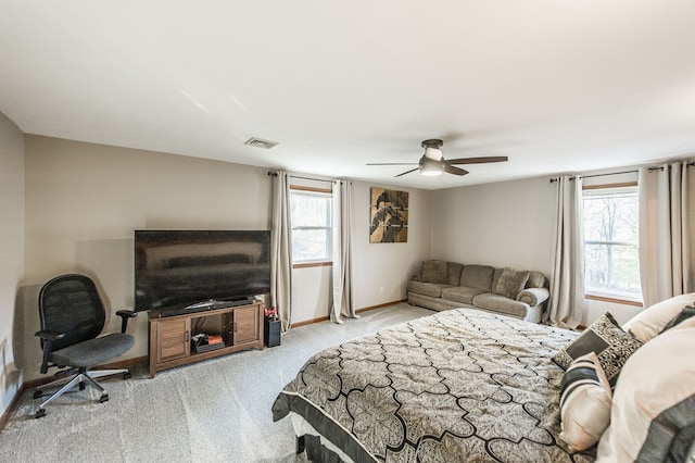 bedroom featuring ceiling fan and light carpet