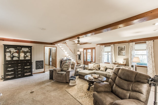 living room with carpet flooring, ceiling fan, and beam ceiling