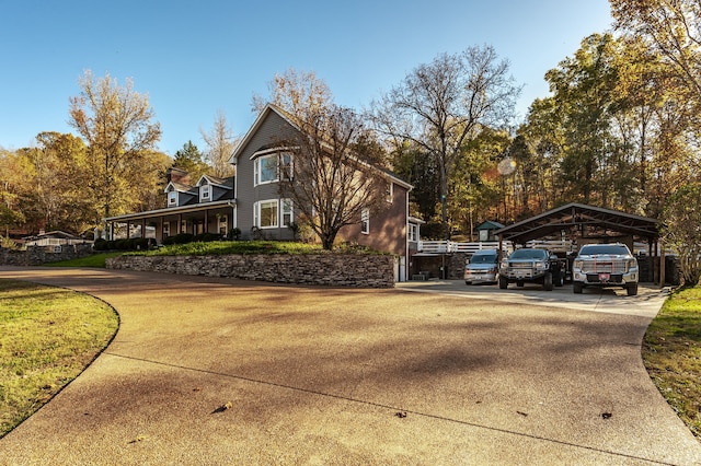 view of side of home featuring a carport