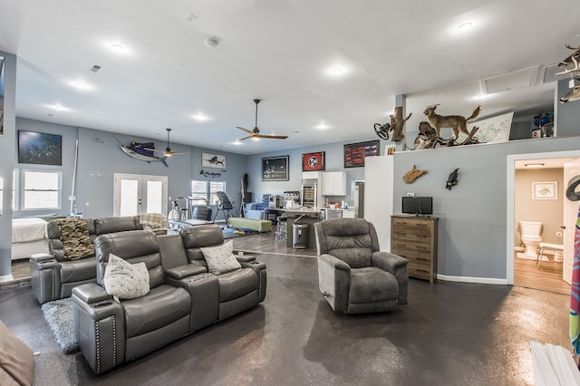 living room featuring french doors and ceiling fan