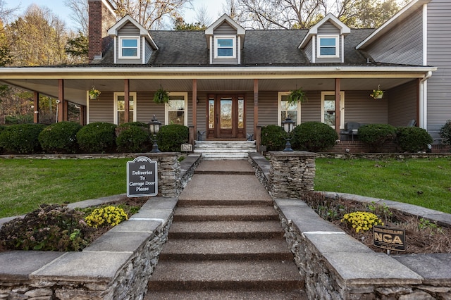 cape cod-style house with a porch and a front yard