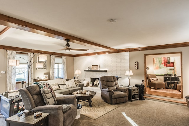 living room with carpet flooring, ceiling fan, beam ceiling, and ornamental molding