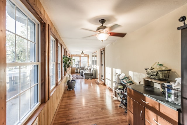 interior space with ceiling fan