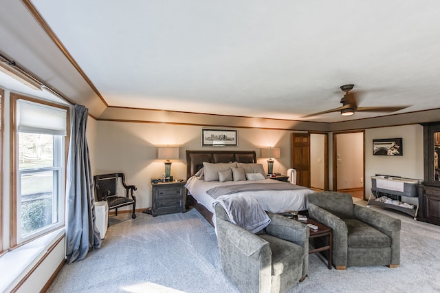 bedroom featuring carpet, ceiling fan, and crown molding