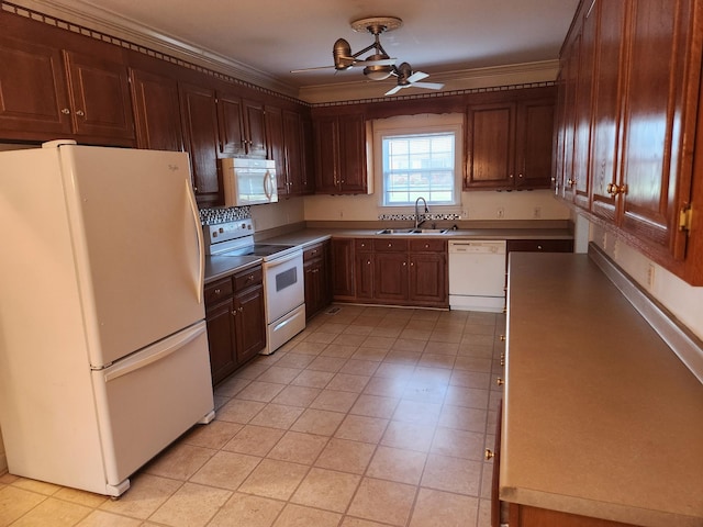 kitchen with white appliances, ceiling fan, ornamental molding, and sink