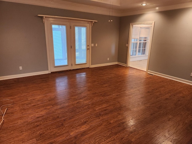 unfurnished room featuring dark hardwood / wood-style flooring and ornamental molding