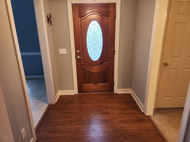 foyer entrance with dark wood-type flooring