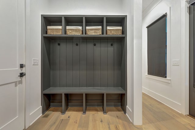 mudroom with light hardwood / wood-style flooring