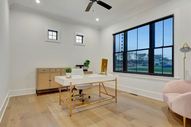 office area featuring crown molding, hardwood / wood-style floors, ceiling fan, and a healthy amount of sunlight