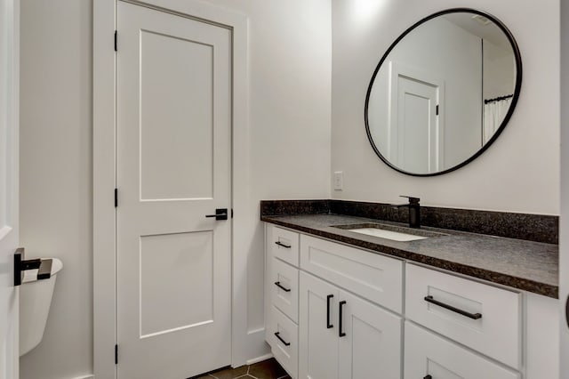 bathroom featuring tile patterned flooring and vanity