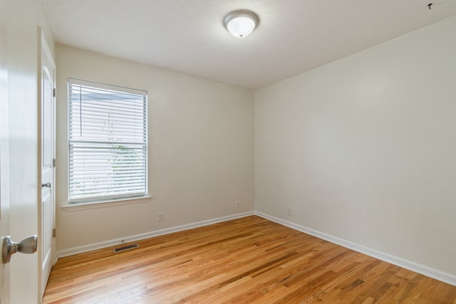 empty room with light wood-type flooring