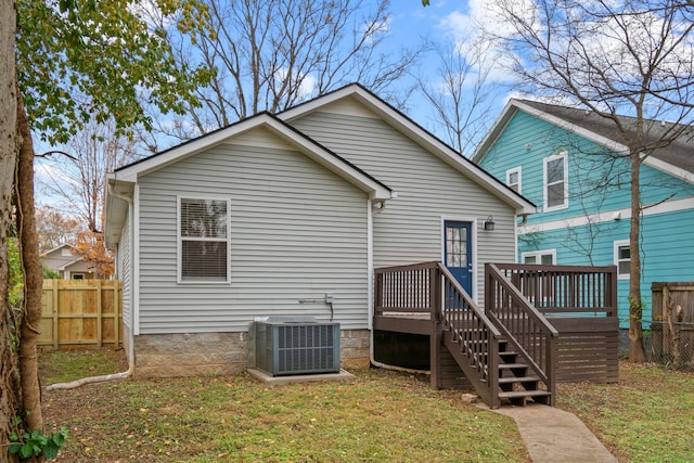 back of house featuring a yard, cooling unit, and a deck