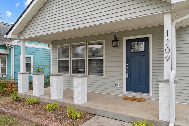 property entrance with covered porch