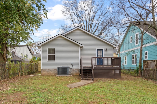 back of house featuring central air condition unit, a yard, and a deck