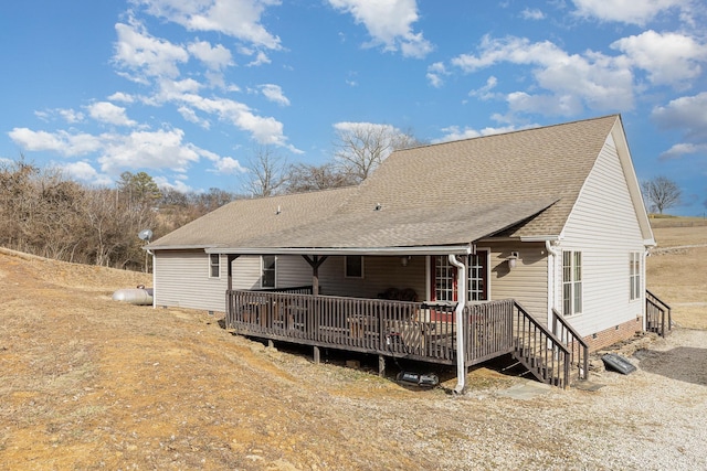 back of house featuring a deck